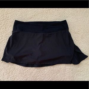 Play Off The Pleats Mid Rise Skirt